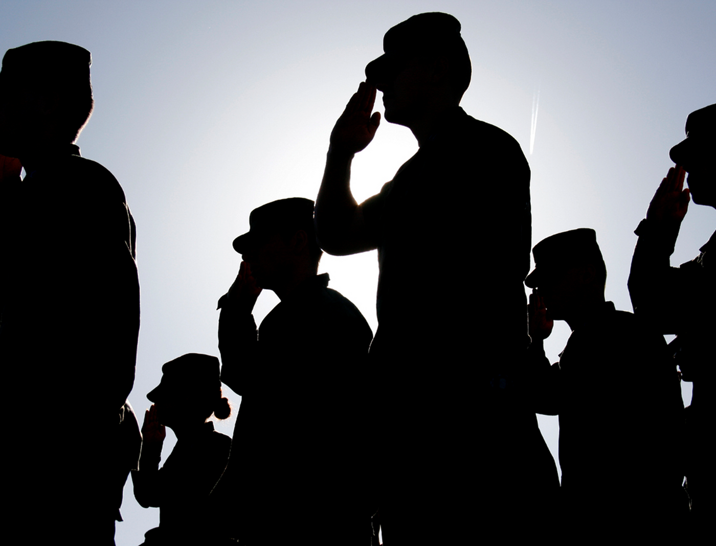 Military members saluting
